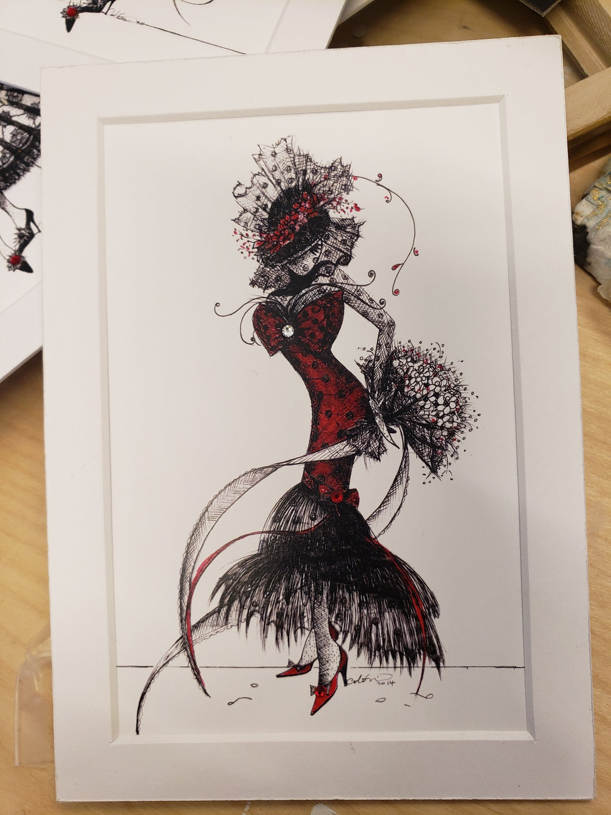 5x7" Artistic illustration of the character MeowCleeva in a red and black feathered dress with floral elements and black polka dots. pen and ink illustration by Martha Colón
