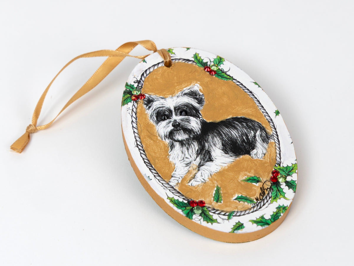 Hand painted Yorkshire Terrier wood ornament adorned with Swarovski crystals. Gold background, holly border, satin ribbon. One of a kind. Perfect gift for Yorkie lovers. $150.