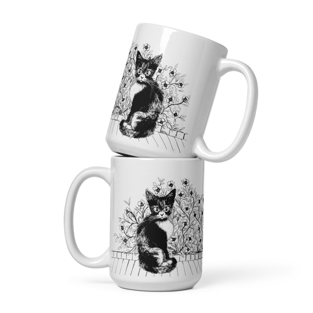 white mugs stacked on top of each other with black and white cat illustrations by Martha Colón