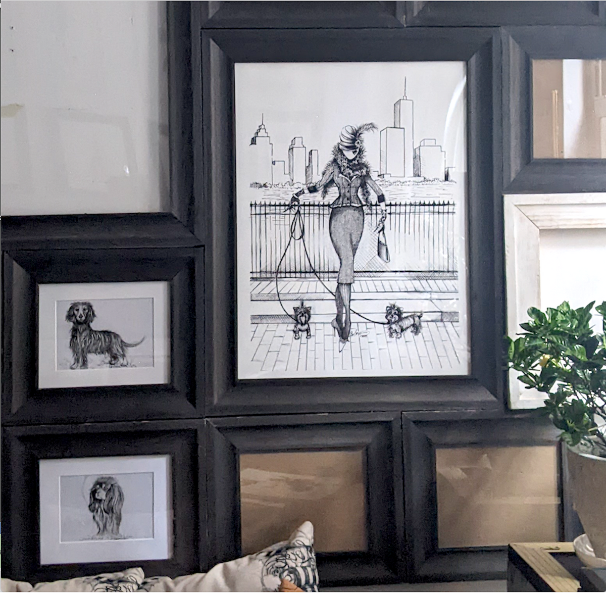 Black and white wall art print featuring MeowCleeva and two Yorkshire Terriers with NYC skyline