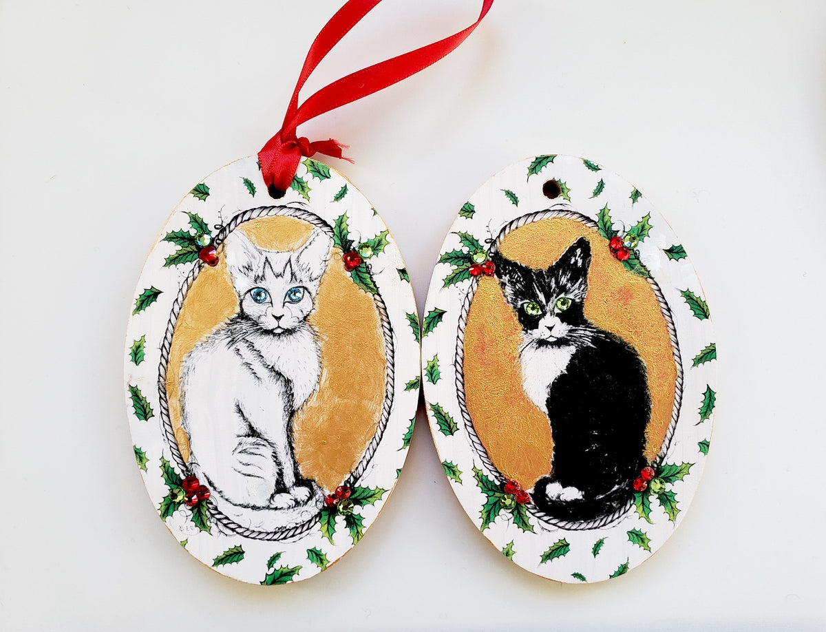 MeowCleeva® holiday wood ornaments hand painted one by one by NYC artist Martha Colón in her Garment District studio. Each ornament individually adorned with genuine Swarovski crystals. One of a kind — no two ever alike. Holiday collection.