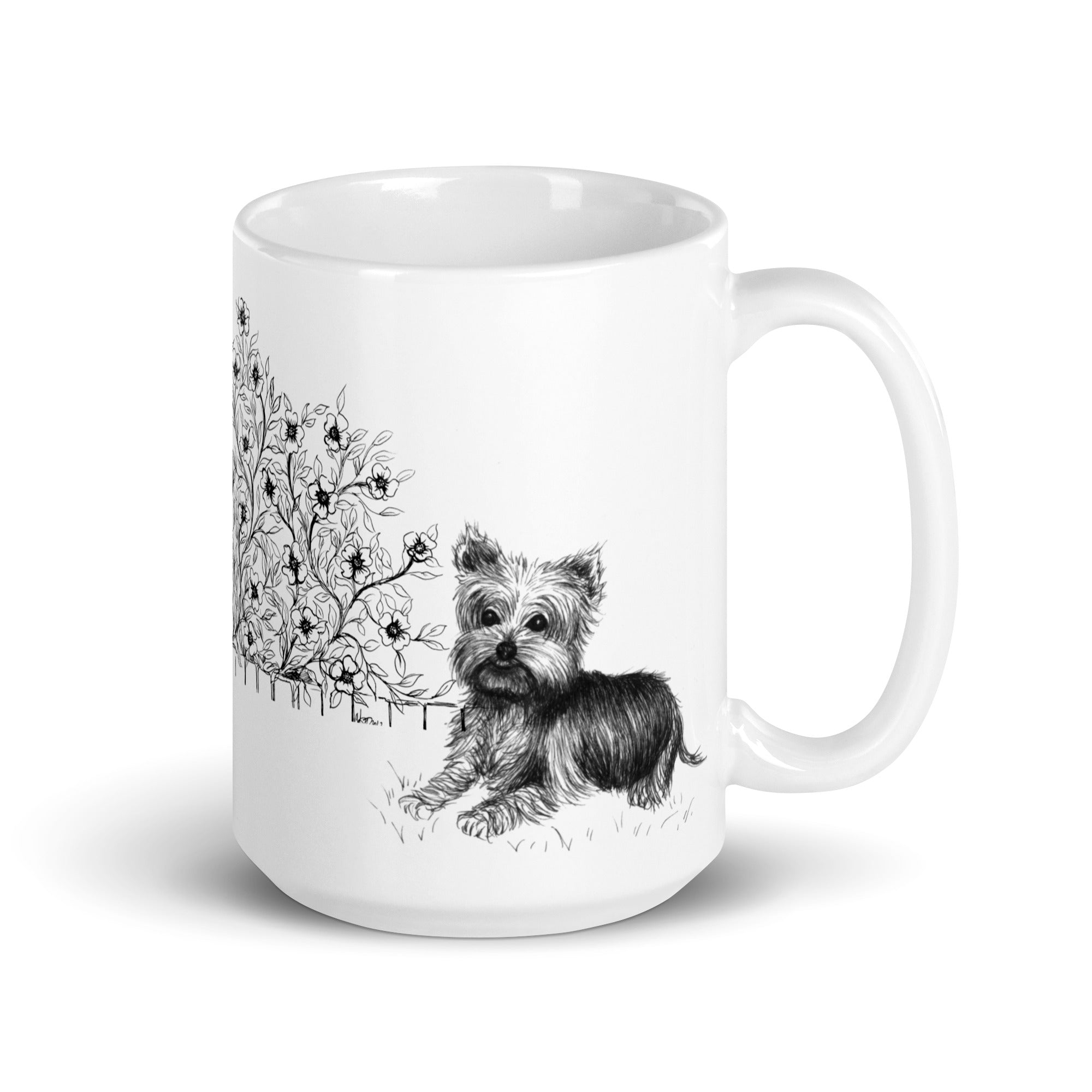 White ceramic  mug with a black and white illustration of a  yorkie dog and floral design by Martha Colón