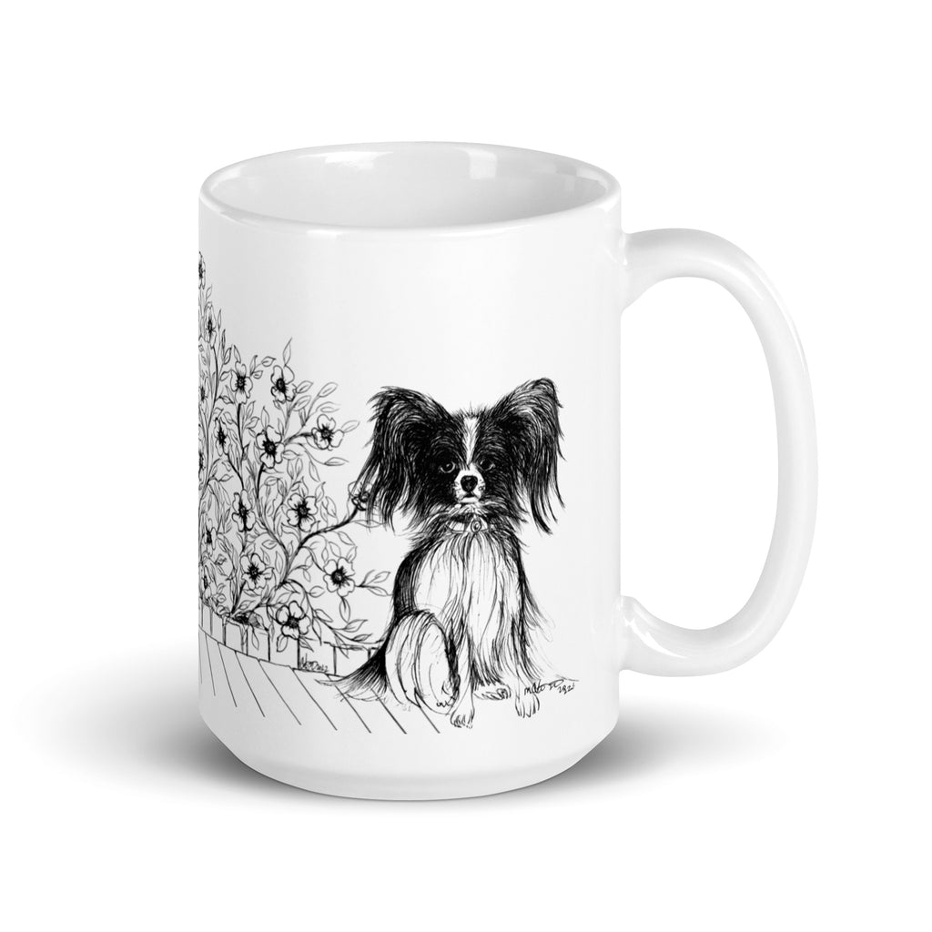 White mug with a black and white Papillon illustration by Martha Colón