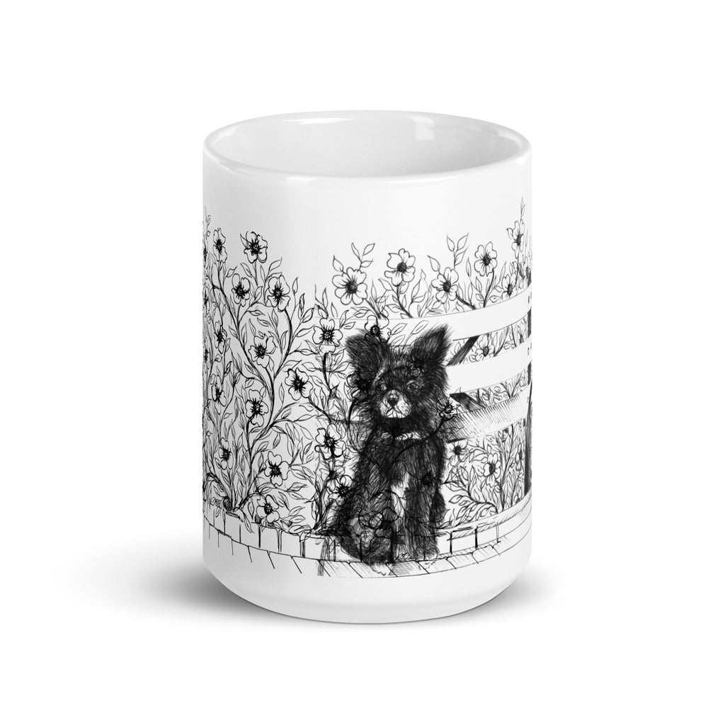 White mug with black and white illustration of a  black long hair chihuahua sitting around floral patterns design by Martha Colón