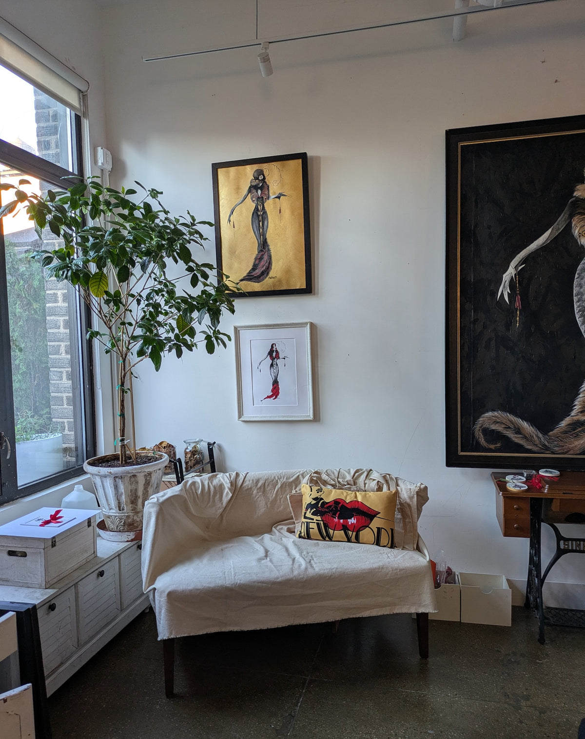 Living room decor art wall frames layout with MeowCleeva art by Martha Colón